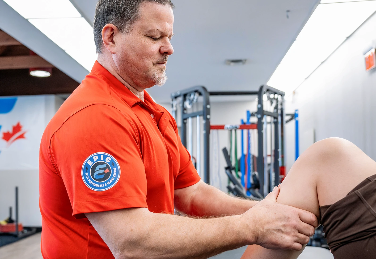sports medicine instructor helping patient