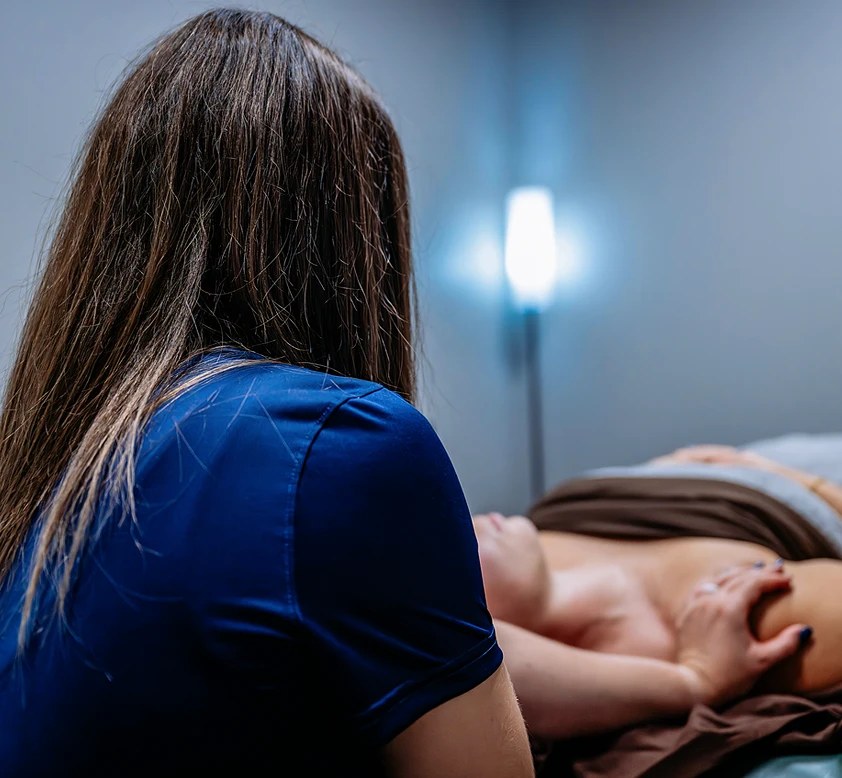 instructor performing treatment on patient