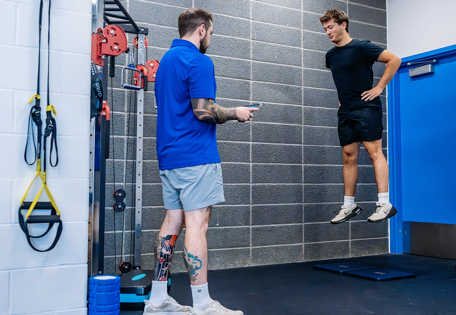 instructor evaluating ahtletes ability