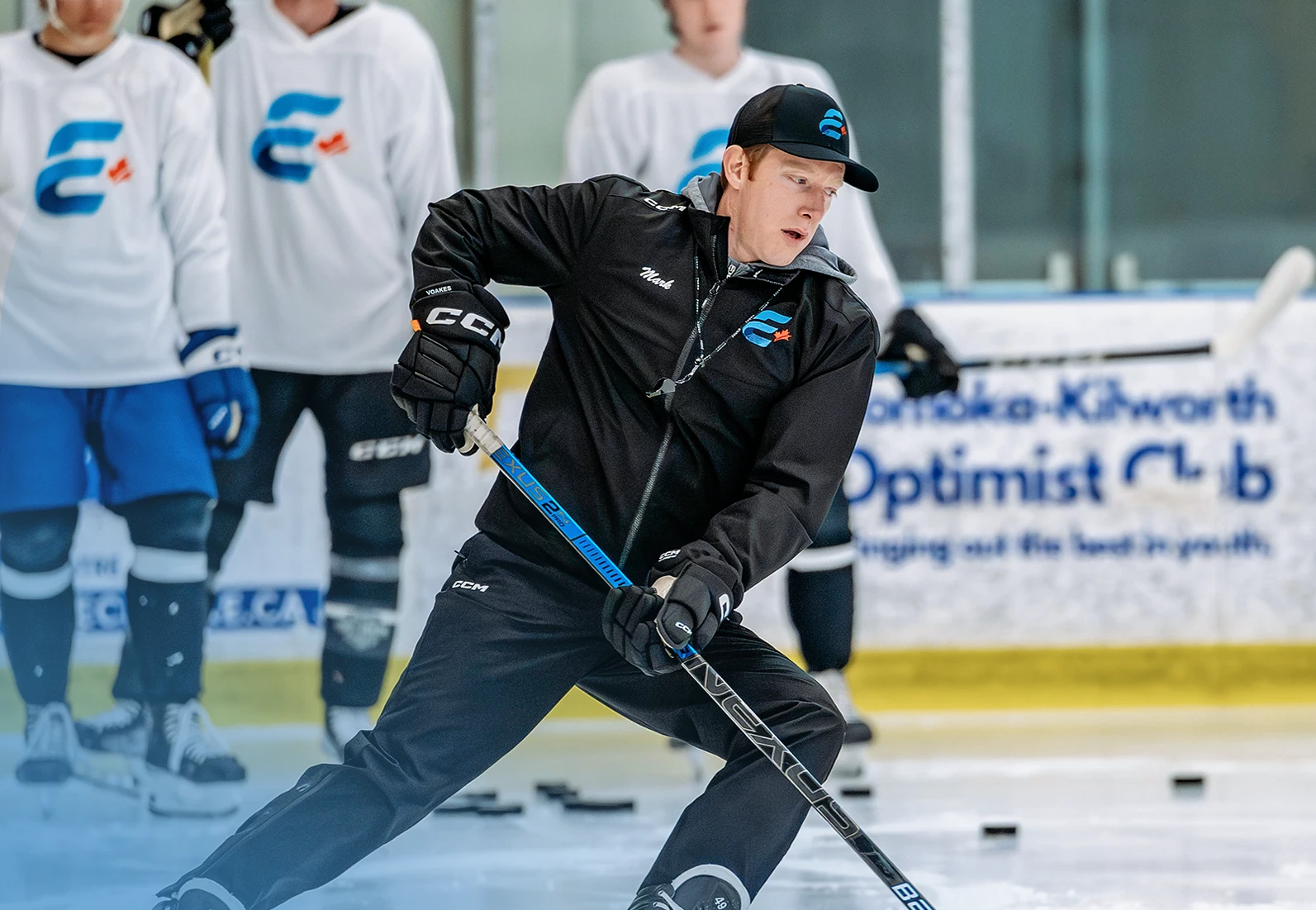 instructor on ice demonstrating instruction